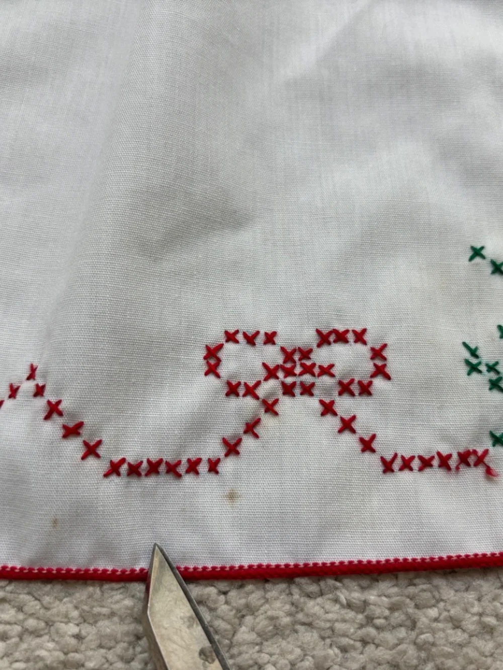 Vintage white half apron featuring hand-stitched cross-stitch Christmas trees